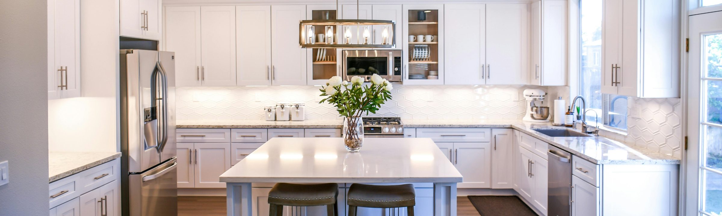A bright, spotless kitchen cleaned by The Cleaning Queen LLC
